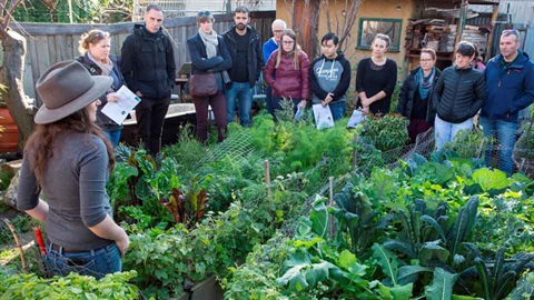 Sustainable-Darebin-educator-talking-to-group-in-garden.jpg