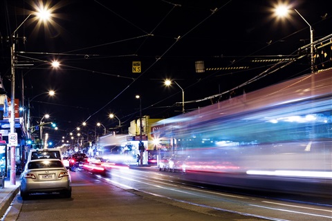 Cars racing past streetscape at night in Darebin.jpg