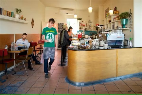 cafe scene people eating person walking through