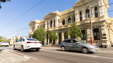 Streetscape with cars driving in Northcote