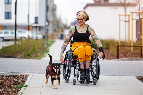 all-abilities-around-darebin-young-woman-in-wheelchair-with-small-dog-on-lead.jpg