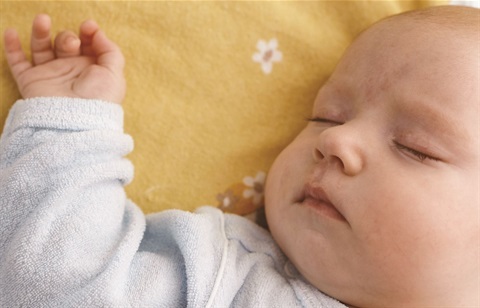 Baby sleeping on yellow blanket.jpg