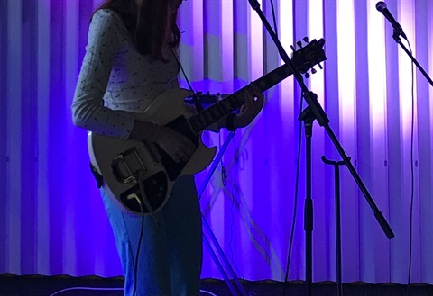 Angela playing guitar.jpg