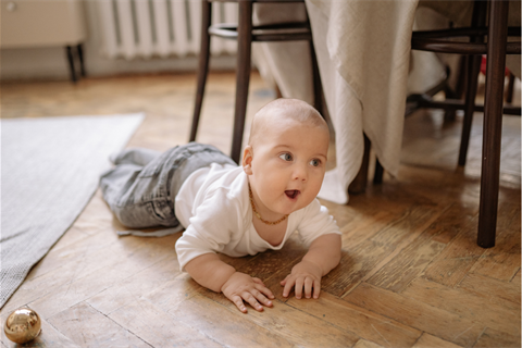 Baby-crawling-on-floorboards.png