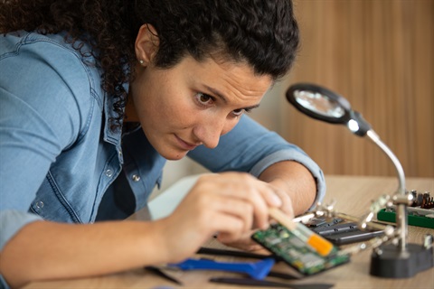 Woman fixing broken mobile phone.jpg